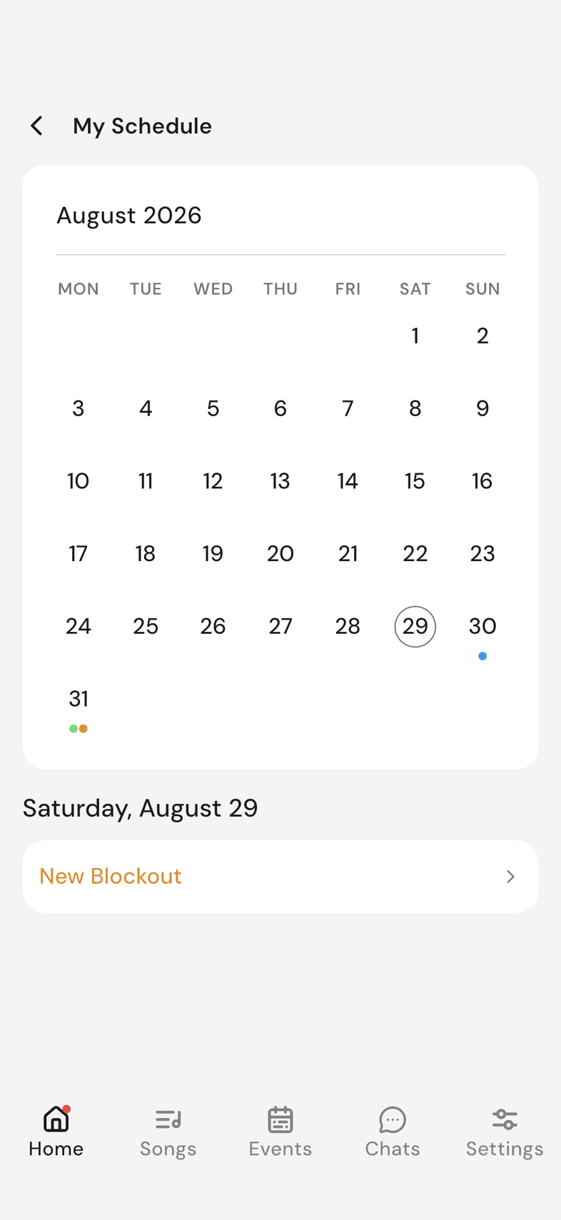 My Schedule month calendar with blue, green, and orange dots on different days